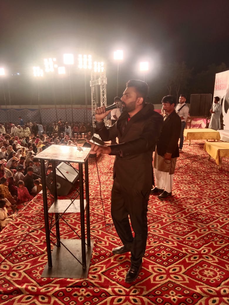 Pastor Shahzad preaching during a Gospel crusade