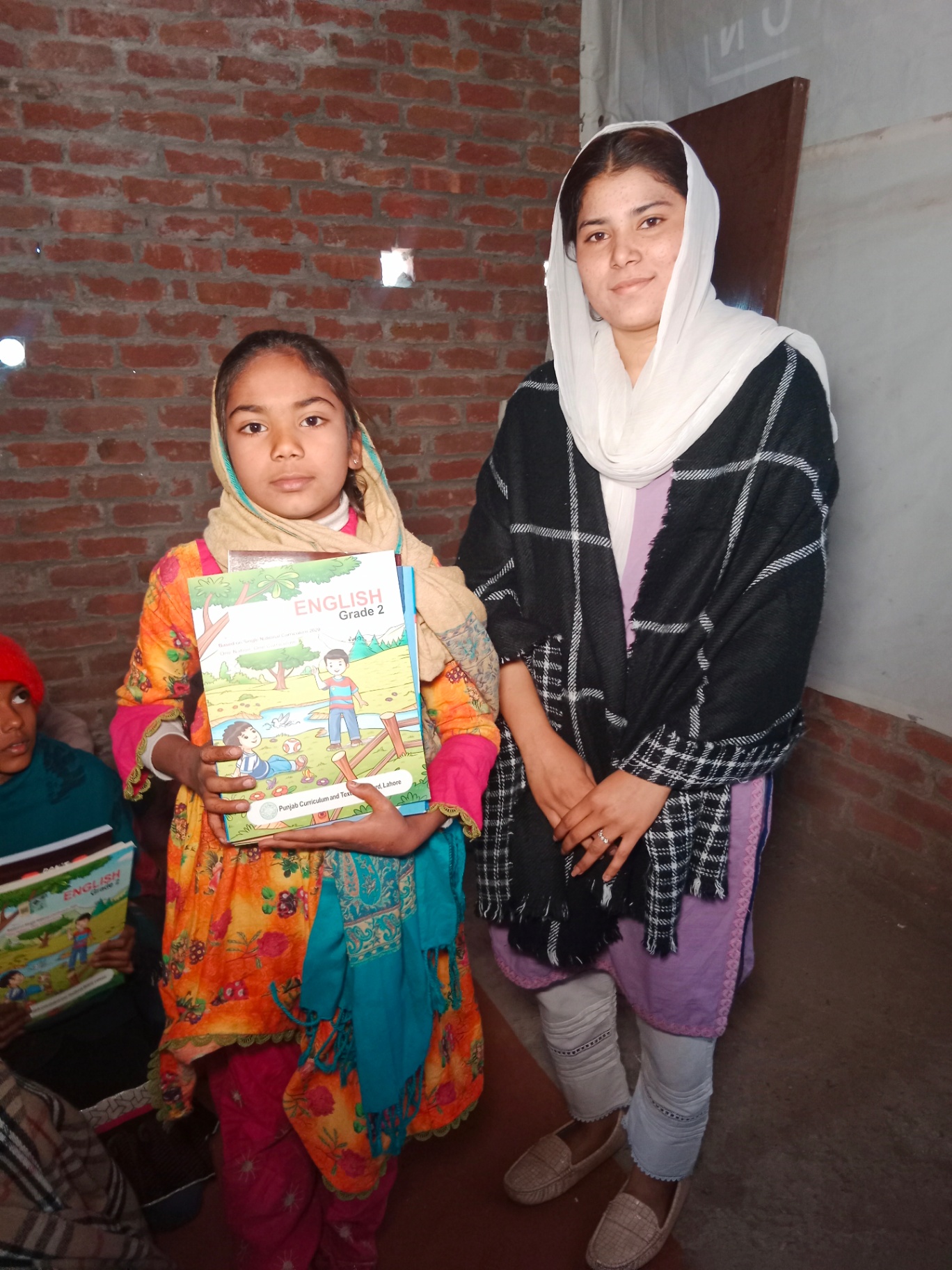Student and teacher with textbooks